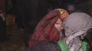 Thousands wait in the snow to be evacuated from Aleppo [upl. by Alrep340]