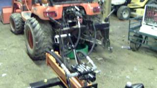 Harbor Freight 3point log splitter attached to a Kubota BX24 [upl. by Dadinirt]