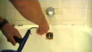 How To Snake Out A Bathtub Drain [upl. by Yedsnil426]