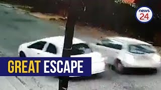 WATCH Motorist escapes hijacking reverses into assailants car [upl. by Riba717]