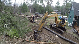 Cutting down trees and grading dirt [upl. by Ollecram]