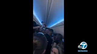 Sunwing party flight video Canadians stuck in Cancun after drinking vaping maskless aboard plane [upl. by Itraa]