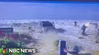 Californians flee from big waves as water breaks over a sea wall [upl. by Pierrepont]