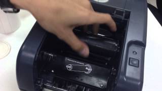 How to install film and sticker in TSC TTP247 barcode printer [upl. by Linetta]