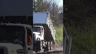 Watch this truck dump BRAND NEW ballast along the tracks train railway [upl. by Itteb]