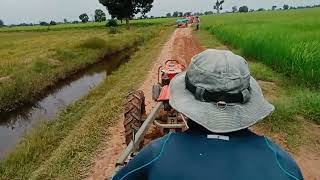 Kubota RT 140 plus Transport rice  Khmer farmer 🌾🌾 [upl. by Ellita]