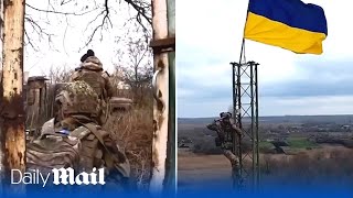 Ukraine border guards hoist flag in Budarky after soldiers battled north of Kharkiv [upl. by Gillian962]