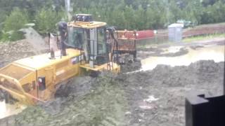 Landfill compactor stuck in the mud [upl. by Ariayek321]