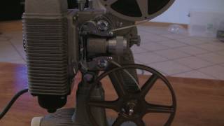 Loading and Rewinding an 8mm Projector Revere 85 [upl. by Saffian]