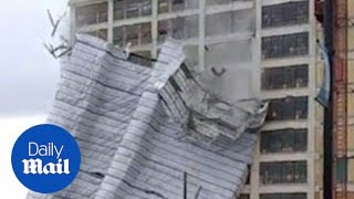 Scaffolding of an entire building falls off after high winds  Daily Mail [upl. by Enneillij245]