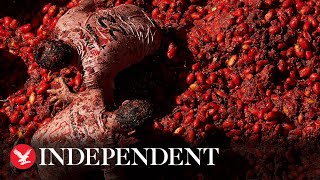 Watch again Revellers play in tomato pulp during the annual food fight festival in Spain [upl. by Nakasuji]