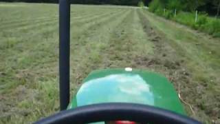 Haymaking time New Holland Rolabar rake pulled by John Deere 790 [upl. by Milzie151]