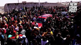 Video shows hundreds of migrants storm across USMexico border bridge  New York Post [upl. by Virginia801]