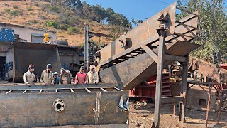 A local mechanic is making a new vibrating screen for a crushing plant from old iron sheets [upl. by Damon]