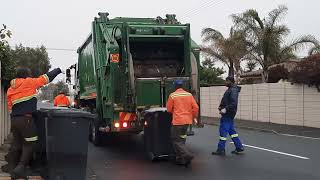 Green compactor garbage truck emptying bins [upl. by Shaya]