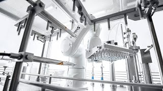 Stäubli robot manages filling and closing of vials at Zellwag Pharmtech [upl. by Friedlander]