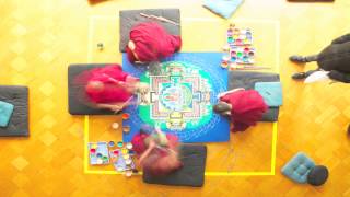 Monks of the Drepung Gomang Monastery create a sand mandala of the Buddha Amitayus [upl. by Inger]