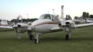 Beech 95 Travel Air N333JG Startup and Departure from KOSH 73011 [upl. by Kalinda]