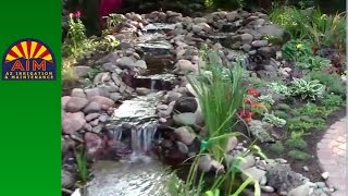 Backyard oasis pavers rock trees water dueling water features [upl. by Kareem481]