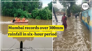 Mumbai rains Heavy rain lashes Mumbai train services affected [upl. by Bever]