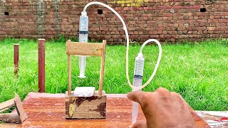 How to make hydraulic press using syringe  science project 🔥 [upl. by Miksen]