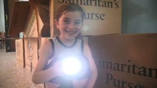 Georgian Girl Shines Her Flashlight From Her Operation Christmas Child Shoe Box [upl. by Iene662]