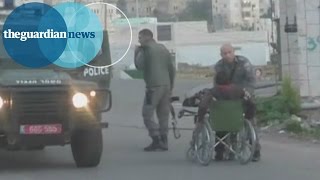 Israeli policeman pushes Palestinian out of wheelchair [upl. by Amadis465]