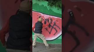 COVERING SWASTIKA WITH GRAFFITI FOOD 😁 graffitiart graffiti shorts [upl. by Ogirdor]