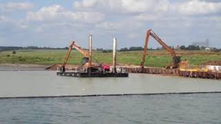 Dredging material inside a silt curtain on a reservoir [upl. by Samoht105]