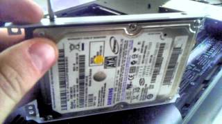 Compaq Presario CQ57  How to remove hard drive and install a new one [upl. by Ayarahs]