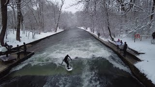 River Surfing in Munich  Surfing on the EisbachIsar  A snowy day English Garden Germany4K [upl. by Corabelle]