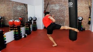 How to Do a Roundhouse Kick  Kickboxing Lessons [upl. by Eugenides]