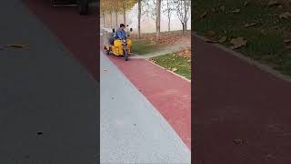 The process of clearing fallen leaves on sidewalks with high pressure water guns [upl. by Carmencita397]