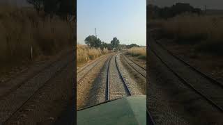 Beautiful live view of train in curve crossing Kaluwal railway station in mountains Pakistan shorts [upl. by Binnings]