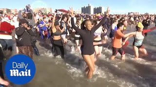 Hundreds brave cold water for Polar Bear Plunge at Coney Island [upl. by Leik]