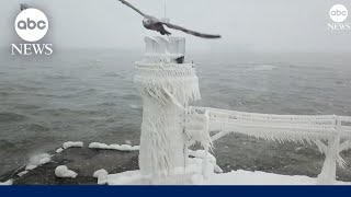 Lighthouses shrouded in ice on Lake Michigan shore [upl. by Linders251]