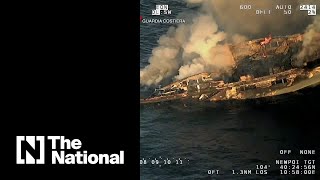 Dramatic footage captures burning and sinking yacht [upl. by Berriman]