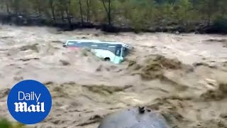 Shocking moment monsoon floods cause bus to be swept away [upl. by Ogires]