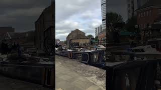 The view at Granary Wharf in Leeds moored narrowboats and old warehouse wharf buildings waterways [upl. by Gifferd964]