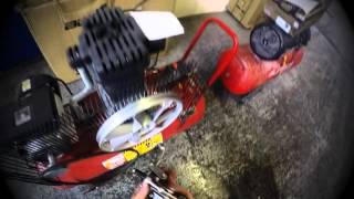 How to remove a belt pulley wheel from an air compressor [upl. by Aydan548]