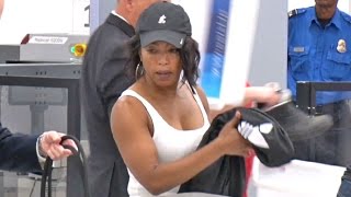 Angela Bassett Shows Of Her Biceps Going Through LAX TSA [upl. by Hartmann]