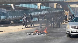 Protesters build barricades in Dakar as clashes follow Senegal election postponement  AFP [upl. by Aicila371]