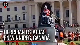 Derriban estatuas en Canadá tras escándalo de fosas de niños indígenas en internados  El Espectador [upl. by Elrebma157]