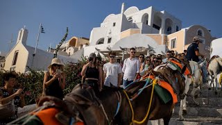 Greeces Santorini bursts with tourists as locals seek cap  REUTERS [upl. by Notserk198]