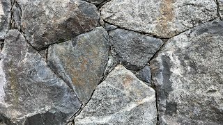 Secrets to creating a beautiful NATURAL STONE WALL Insights from a real stonemason [upl. by Surtimed54]