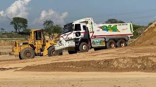 New Cat 980M Wheel loader Loading Volvo FH12 Semi Trucks [upl. by Tynan]