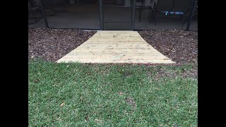 diy wooden walkway path through garden installing the base level [upl. by Ilellan]