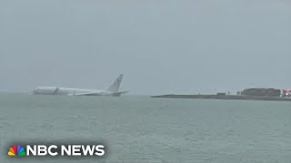 US military aircraft overshoots runway and lands in Hawaii bay [upl. by January]