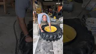 Airing up a tractor tire [upl. by Nirtiak]