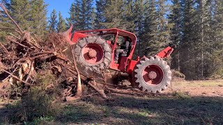 1960s Timberjack skidder making trails and pushing tree stumps [upl. by Eilagam]